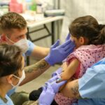 1024px 21st tsc gives afghan evacuees measles vaccine 286844325292028129.jpg