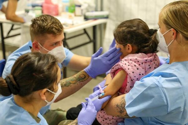 1024px 21st tsc gives afghan evacuees measles vaccine 286844325292028129.jpg