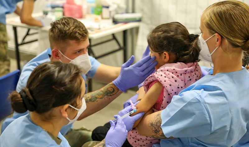 1024px 21st tsc gives afghan evacuees measles vaccine 286844325292028129.jpg