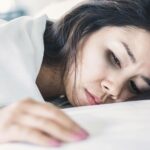 Asian woman fatigue sad body pain.jpg