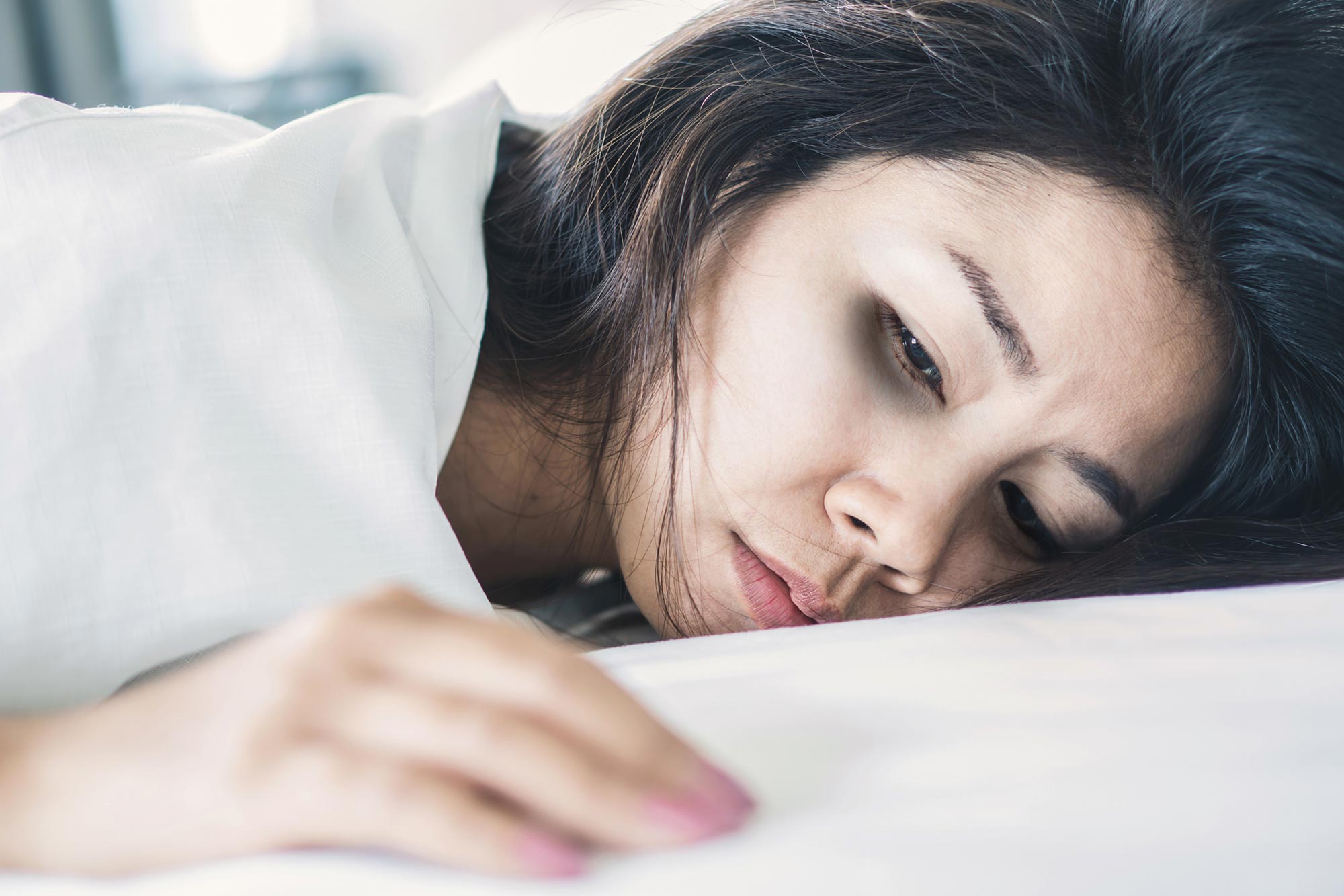Asian woman fatigue sad body pain.jpg
